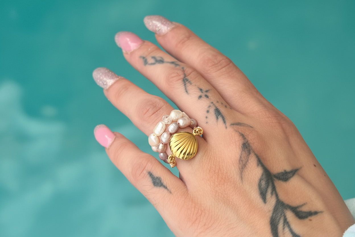 Handmade golden shell pearl ring worn on hand